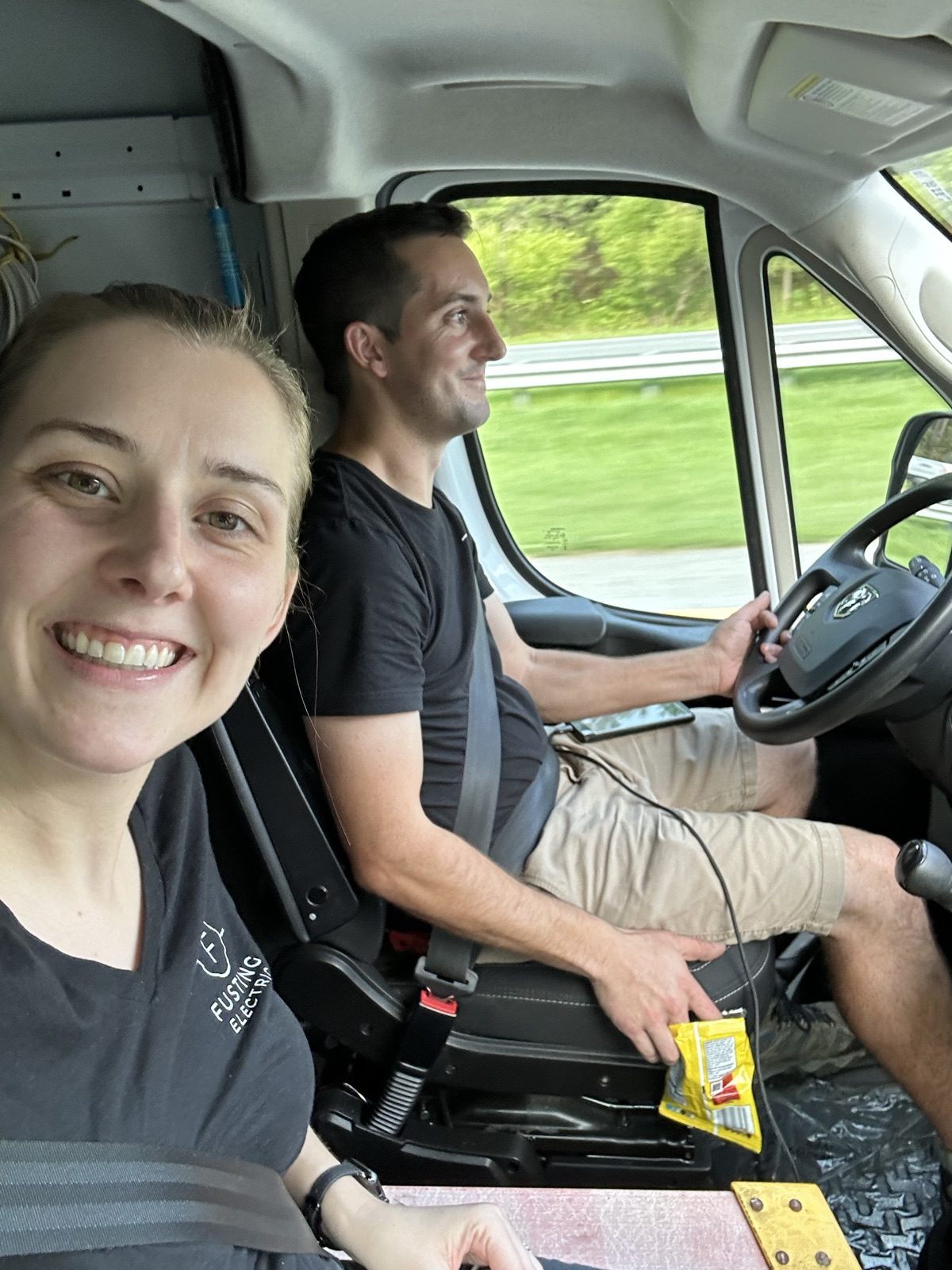 Ceanne and Stephen Fusting riding together in the Fusting Electric work van on the way to a job that required a large ladder