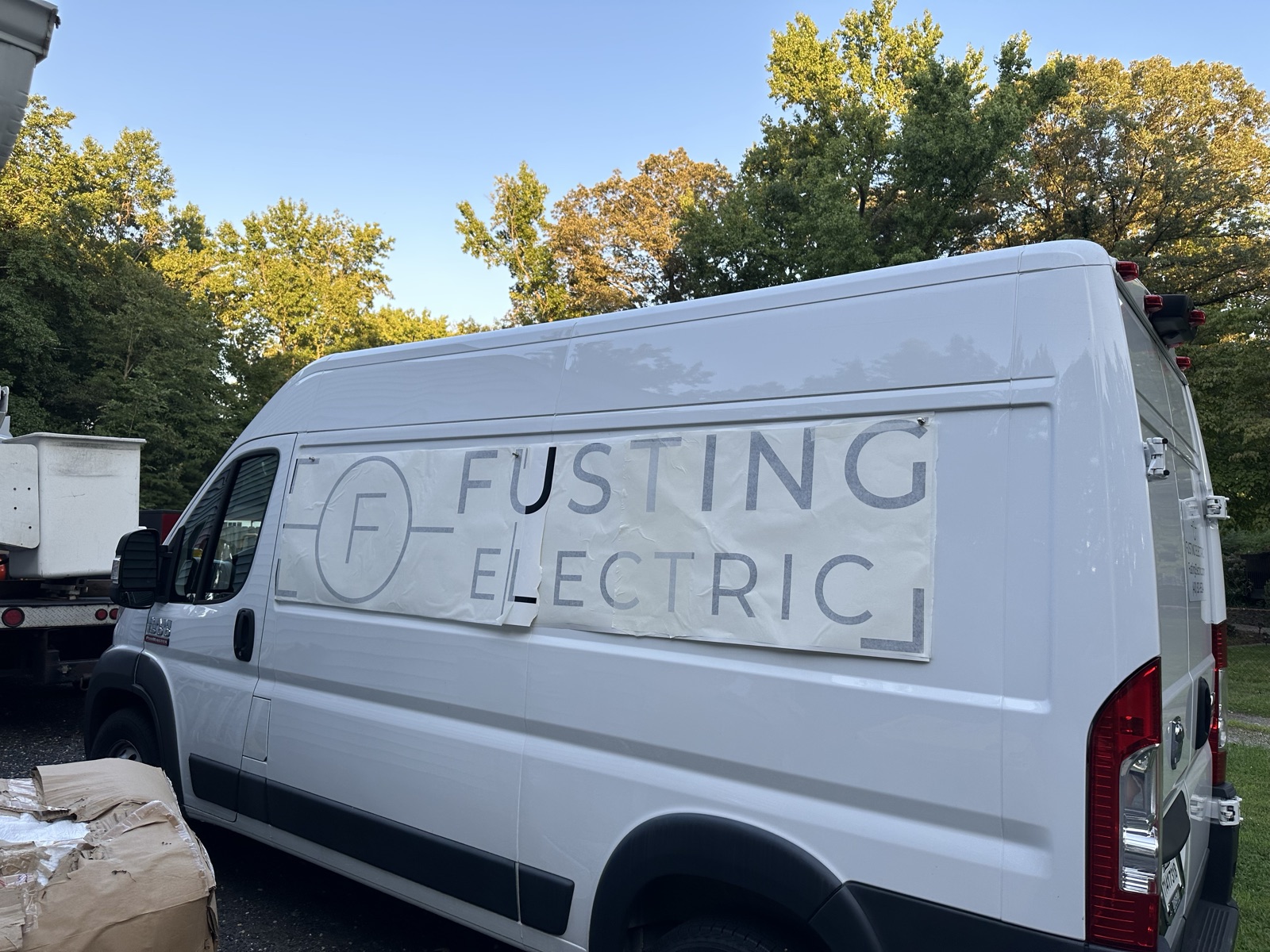 Fusting Electric lettering being applied to the company work van
