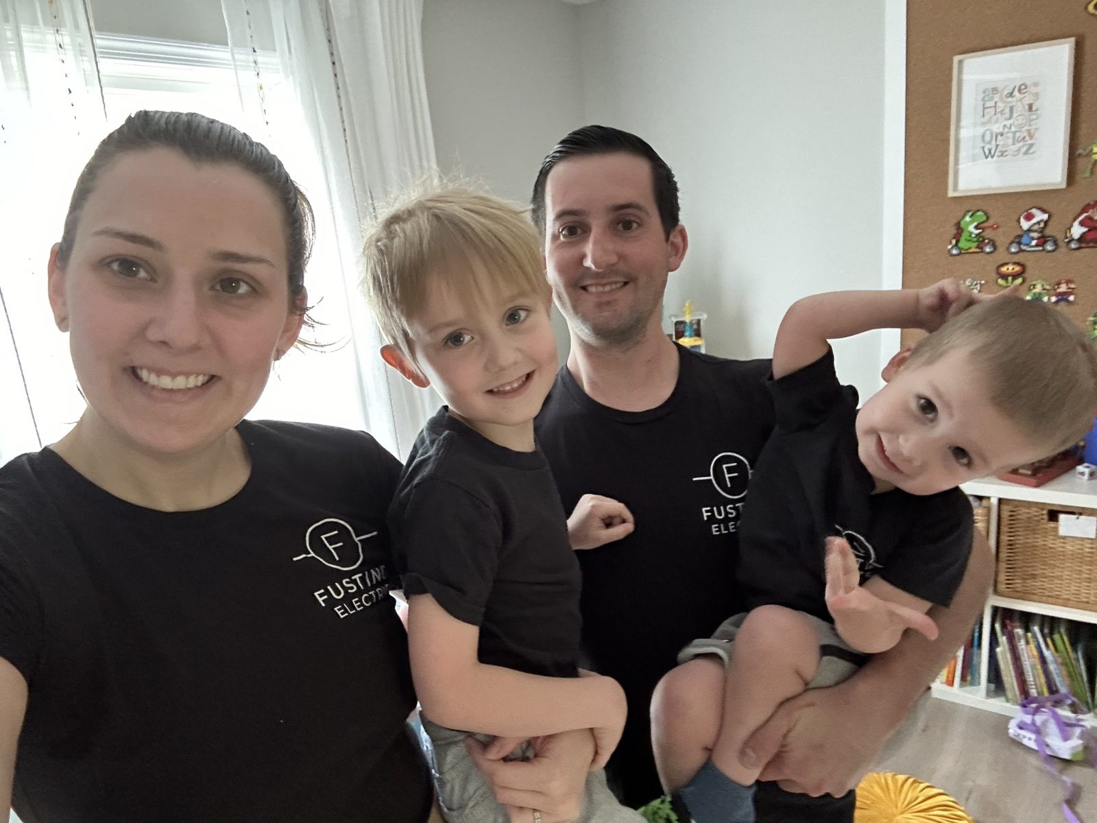 Ceanne, Stephen, Colton, and Dylan Fusting together in matching Fusting Electric shirts